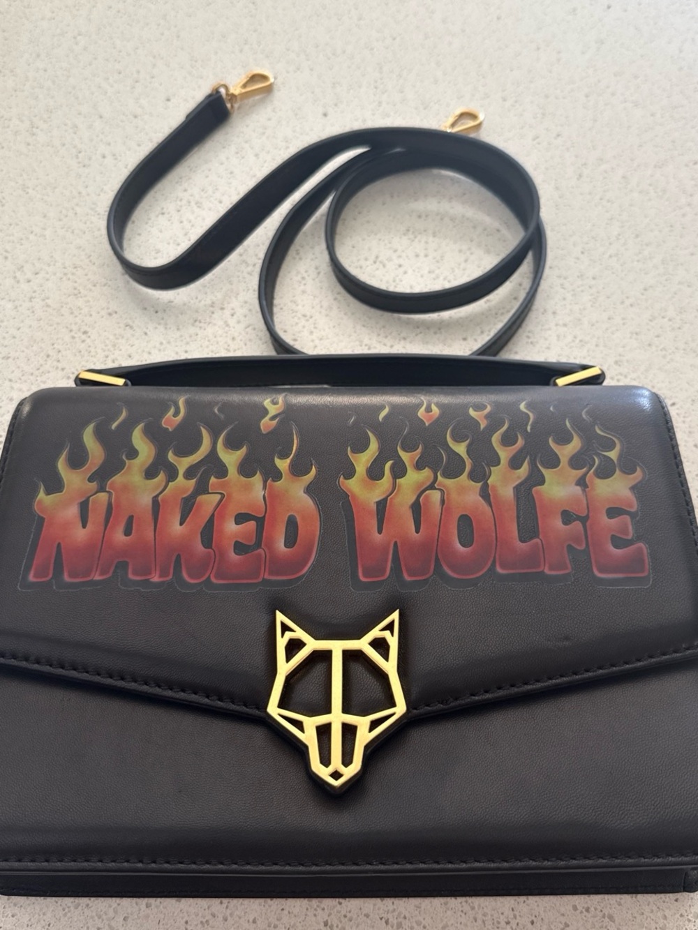 Naked Wolfe Black Crossbody Bag with Red and Yellow Flame Logo